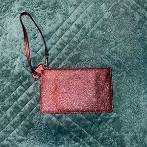 Dark purple Coach wristlet
